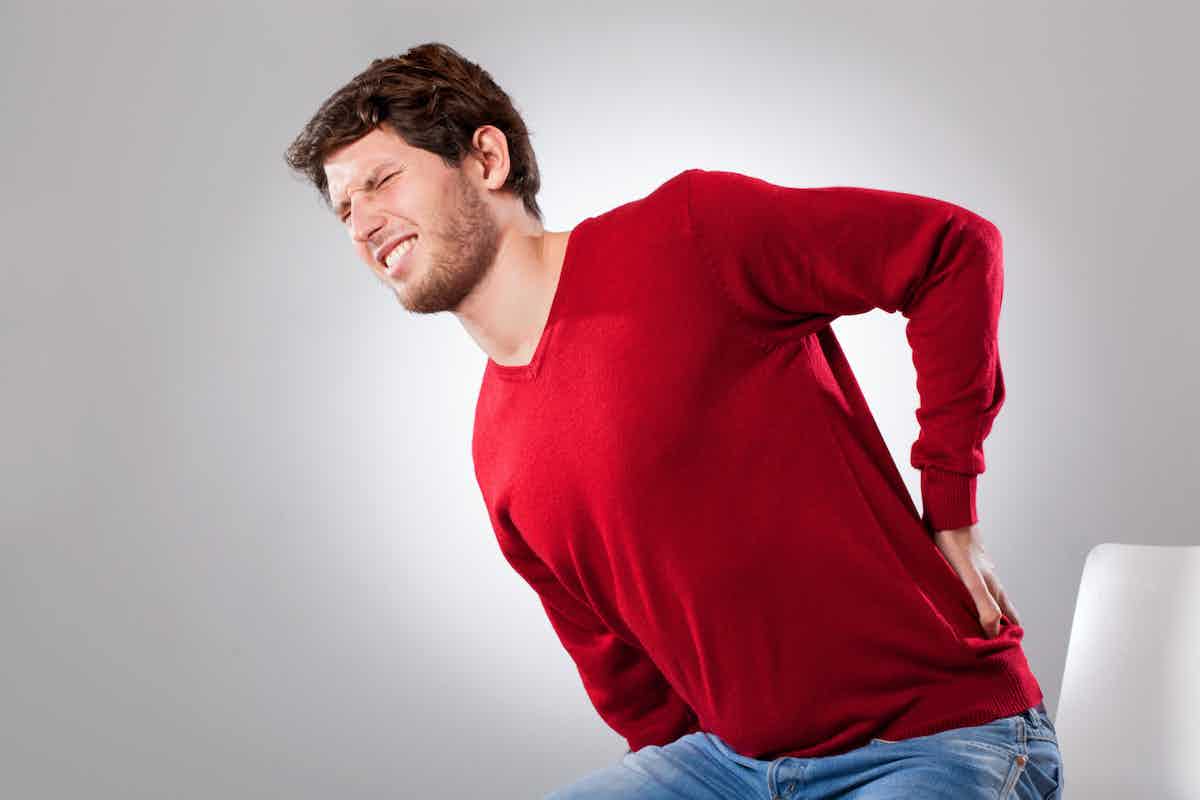 Man Looking to relieve lower back pain